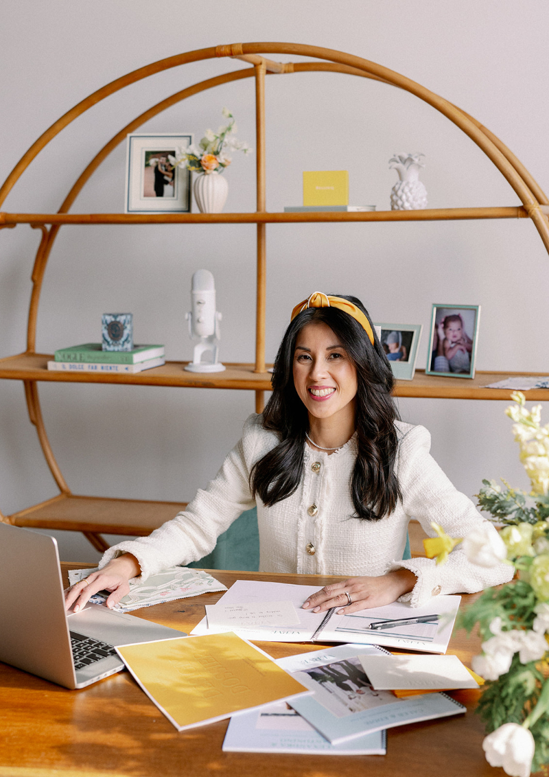 Desirée Adams sits at desk, typing on her laptop about how to know you're ready for full-service planning.